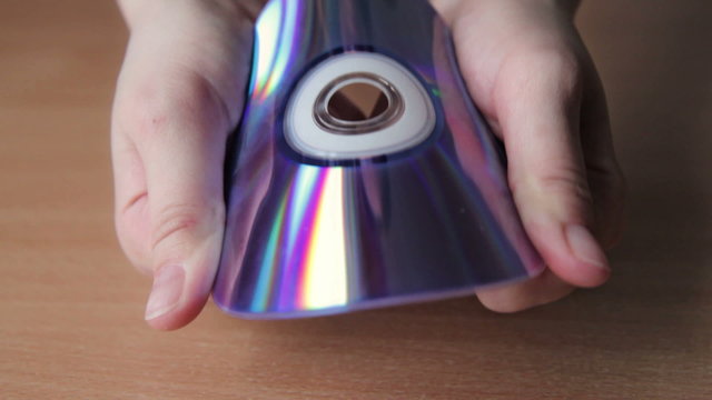 Young Woman Breaking CD, DVD