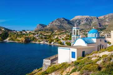 Typical for Greece white church with azure-blue dome