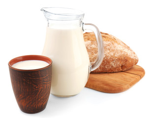 Milk and loaf of bread isolated on white