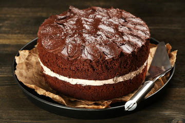 Delicious chocolate cake on table close-up