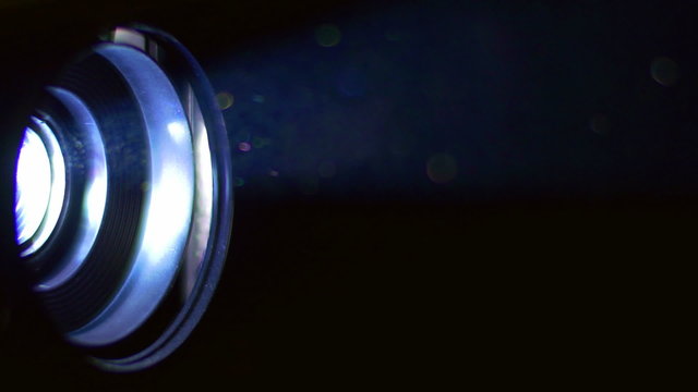 The very bright projector light with seen lens. Macro close up view