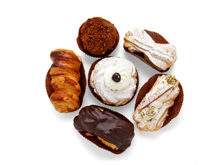 different types of Italian puff pastries: with cream, nuts, choc