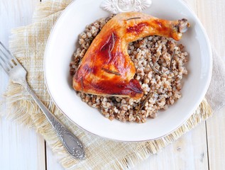 Delicious baked chicken with boiled buckwheat and rosemary sauce