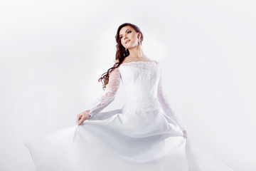 Dance bride in wedding dress, white background