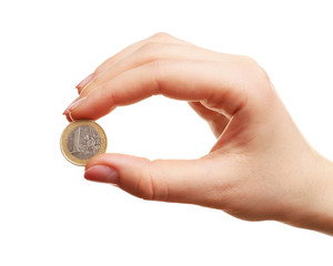 Female hand with coin isolated on white