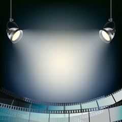 blue background with spot lights and filmstrip
