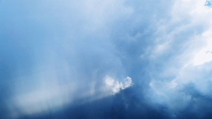 Fototapeta premium Heart from clouds with sunbeams on sky