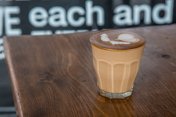 coffe latte cup on a wood table