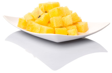 Bite sized yellow watermelon in a white plate