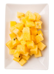 Bite sized yellow watermelon in a white plate