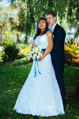 Bride and Groom at wedding Day walking Outdoors on spring nature