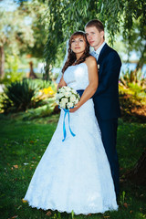 Bride and Groom at wedding Day walking Outdoors on spring nature