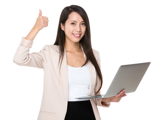 Young businesswoman hold with laptop computer and thumb up