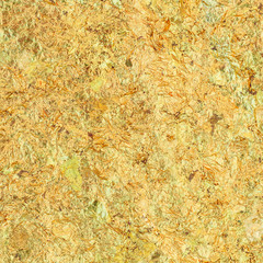 Close up gold plate on the back side of buddha statue