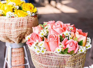 Orange rose in basket