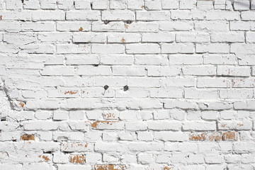 Old brick wall painted with white paint