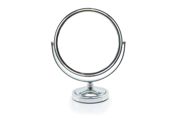 Old silver makeup mirror isolated on white