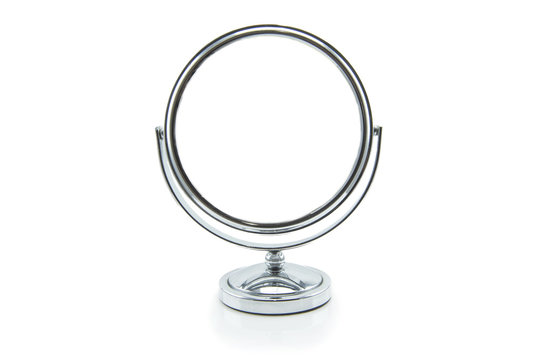 Old silver makeup mirror isolated on white