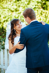 Bride and Groom at wedding Day walking Outdoors on spring nature