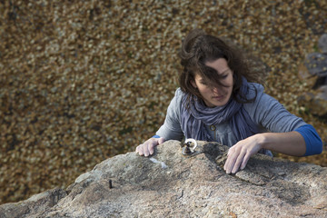 Brunette female climber with strand of hair 