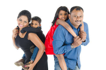 Indian parent piggyback their children