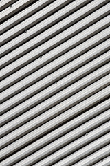 Obraz premium Angled, abstract view of the exterior wall of an industrial building.