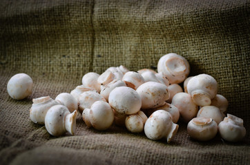 Mushrooms on a hessian background