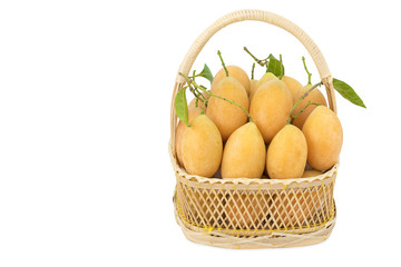 Marian plum in a gift basket on white isolated background with c