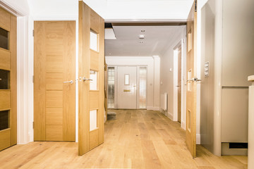 Oak double doors through to entry hall.