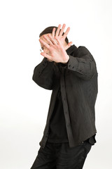 man covers his face and standing isolated on white background