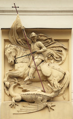 Naklejka premium Saint George killing Dragon. Stucco decoration on Art Nouveau bu