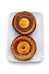 different types of tartlets with chocolate and jam