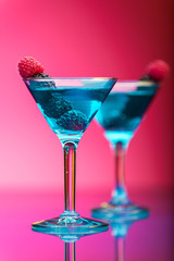 Colorful cocktails garnished with berries