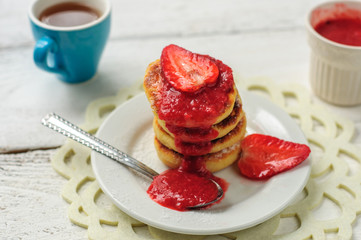 Breakfast with cottage cheese pancakes, strawberry jam and coffe