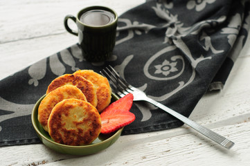 Breakfast with cottage cheese pancakes, strawberry jam and coffe