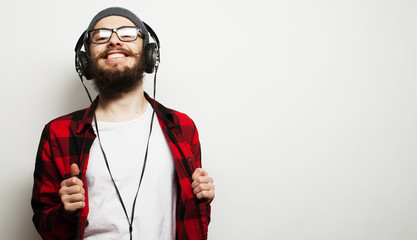  young bearded man listening to music