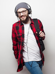  young bearded man listening to music