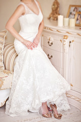 Fototapeta na wymiar Wedding white gorgeous dress in vintage interior