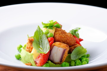 Fried Octopus on basil mousse, green peas and fresh strawberries