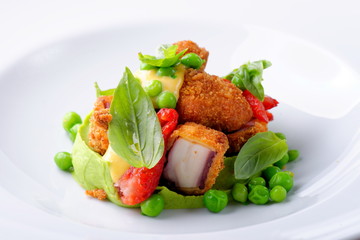 Fried Octopus on basil mousse, green peas and fresh strawberries