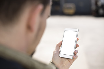 Man using mobile smartphone. Blank screen