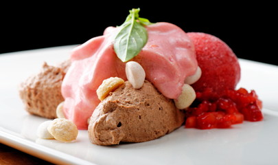 Fine dining dessert, chocolate mousse and strawberry ice cream 