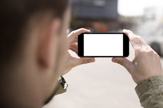 Man taking photos with smartphone