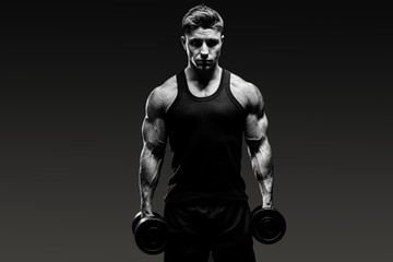 Fototapeta na wymiar muscular bodybuilder guy monochrome over grey background
