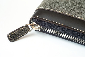 Close up to zip on leather material