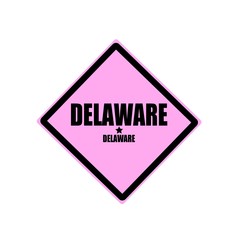 Delaware black stamp text on pink background