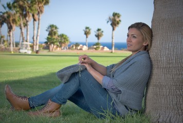 attractive woman relaxing in a autumn landscape