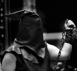 executioner with black hood on his head and the chain