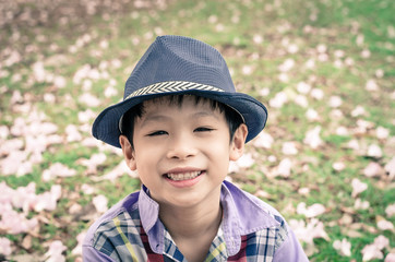 Asian boy smiling in garden,vintage filter effect