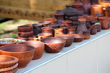 Ceramic brown bowl among ceramic ware